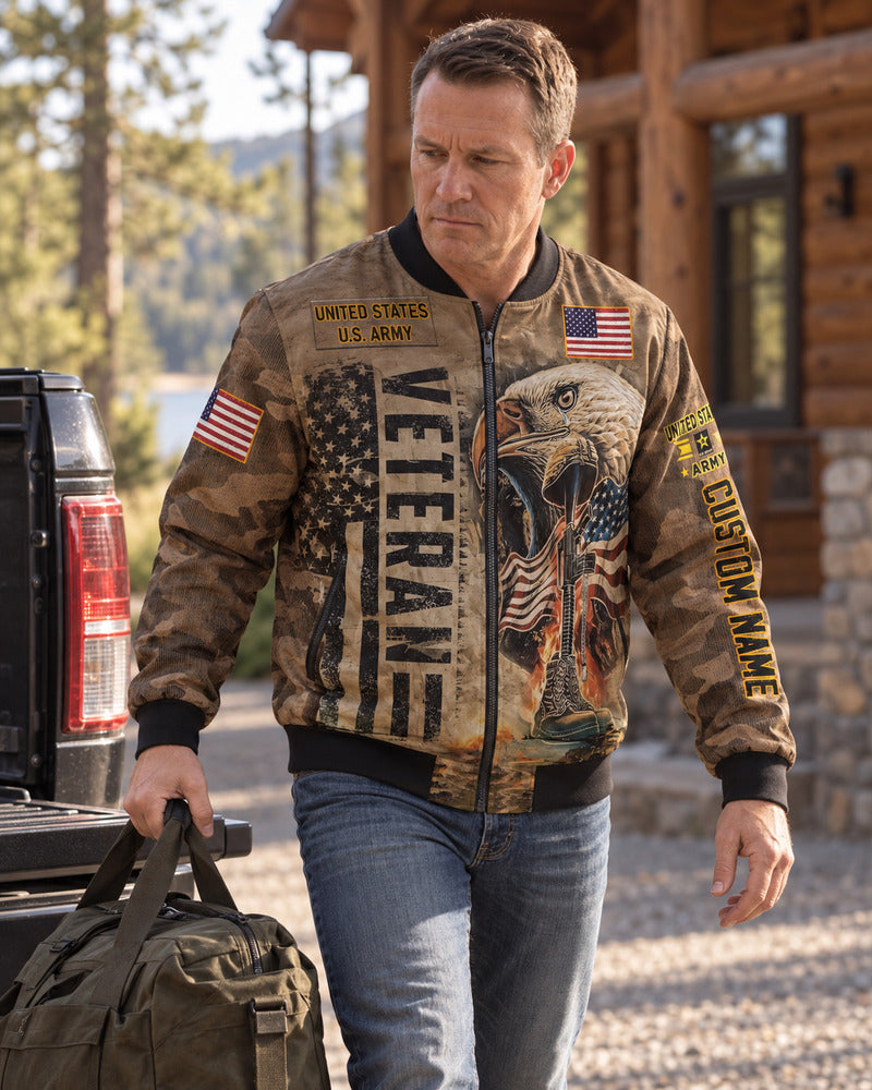 A man carrying a duffel beside a pickup in a personalized Army bomber jacket.