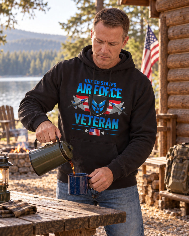 A man pouring camp coffee in an Air Force hoodie.